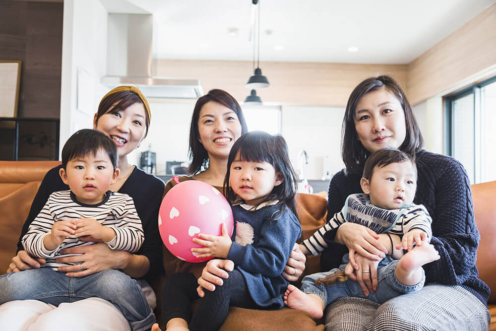 three moms with their children